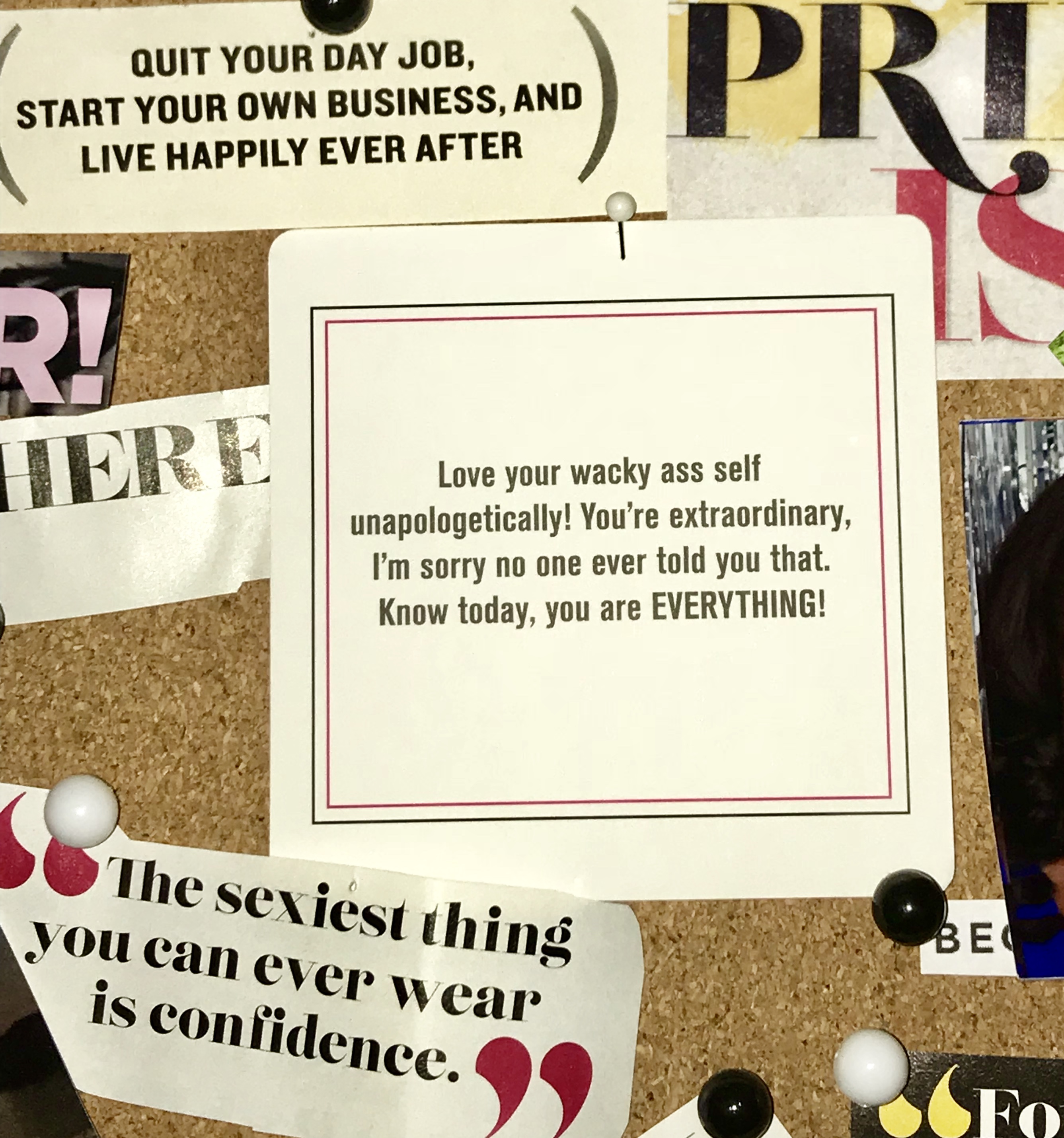 Affirmation card pinned to a corkboard