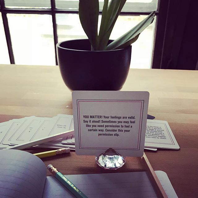 Affirmation card displayed on a desk